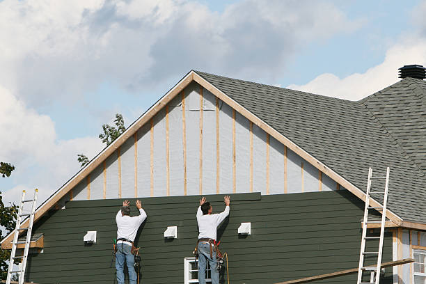 Professional Siding technician working in Westport, NC